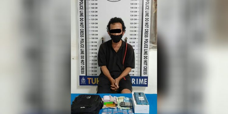 Maidin, 45 tahun, pria yang diringkus polisi dari Jalan Dalil Tani, Kelurahan Tomuan, Selasa (15/12) malam.