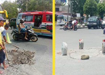 Sejumlah pekerja tengah memperbaiki bekas galian perbaikan pipa di Kota Siantar.