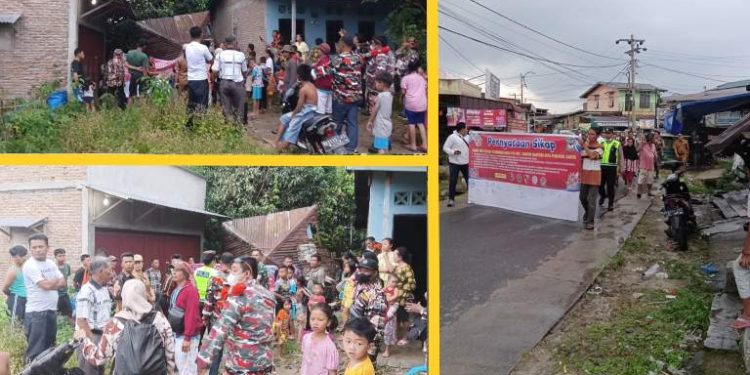 Masyarakat Kelurahan Naga Pitu menggelar aksi perang terhadap peredaran narkoba, Senin (26/12/2022). (isiantar/nda).